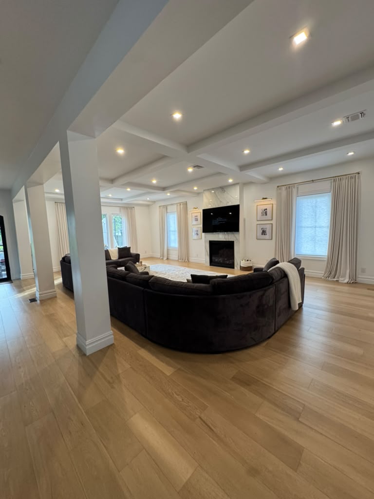 Living Suite with Coffered Ceilings & Linear Fireplace - The High Street Estate