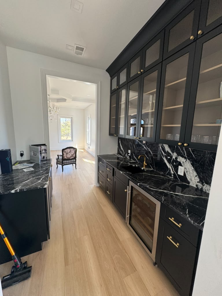 Tailored Wet Bar with Bookmatched Marble - The High Street Estate